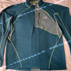 The North Face Men's green performance pullover with neon stitching.